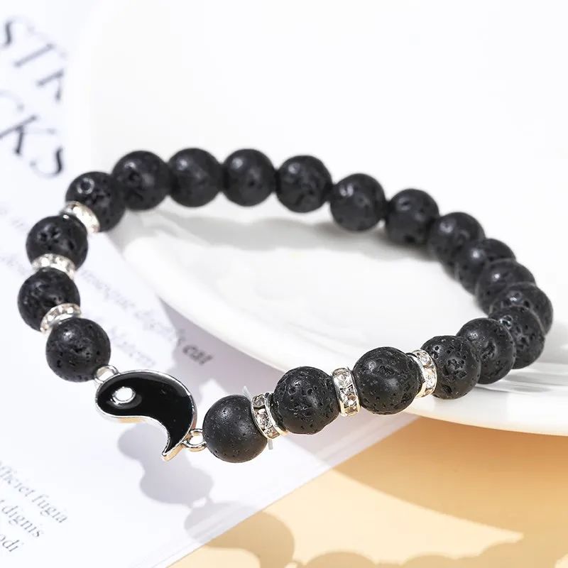 Bracelet Couple Yin Yang pour 2 en onyx noir avec une perle yin yang contrastée.